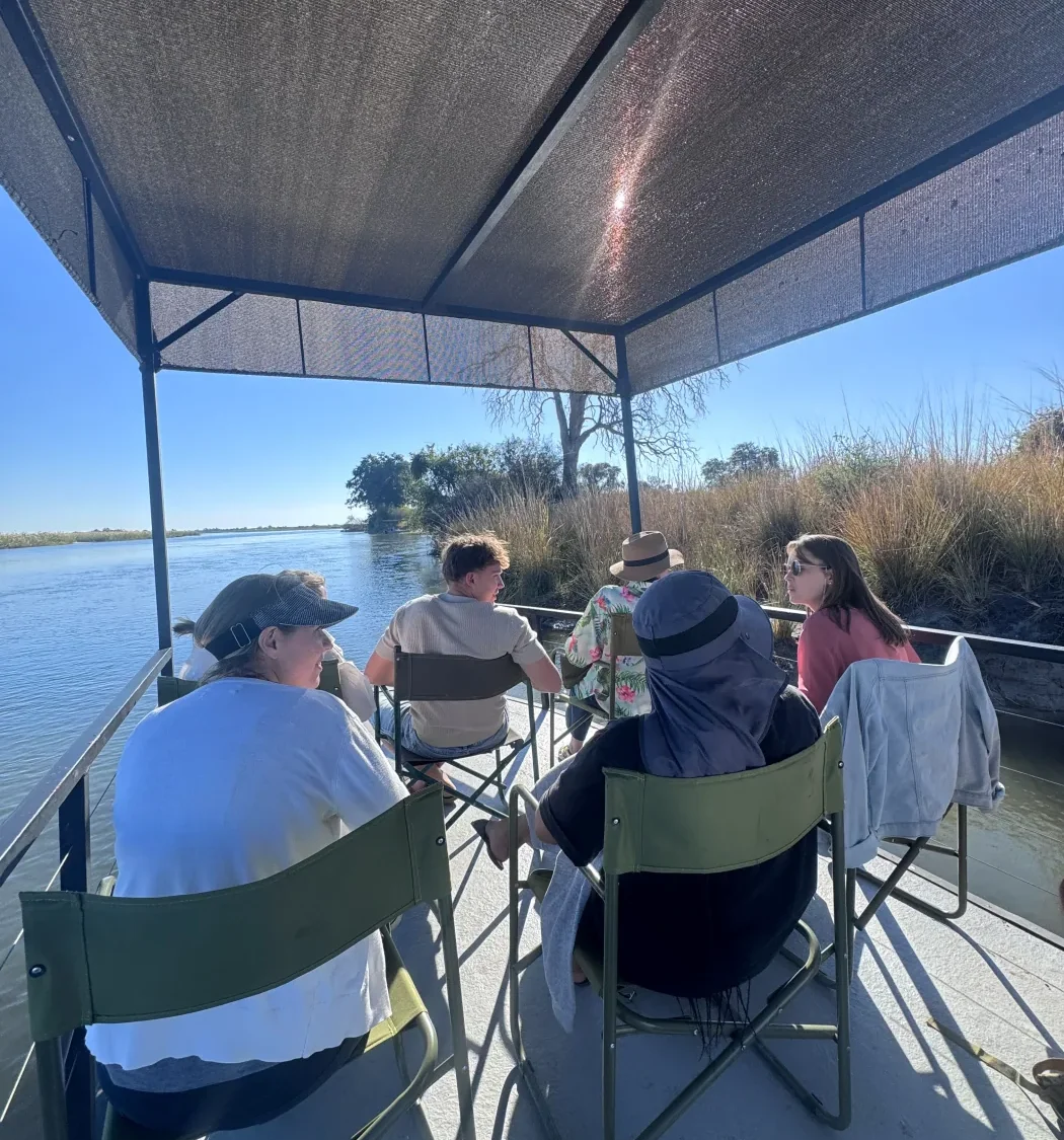 Guests relaxing together on a guided boat cruise