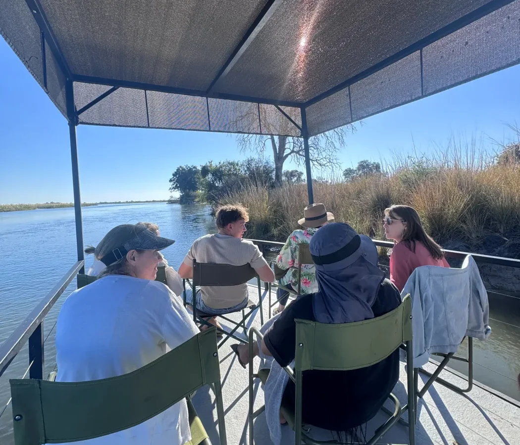 Guests relaxing together on a guided boat cruise