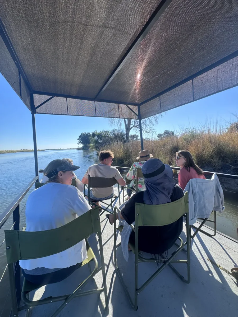 Guests relaxing together on a guided boat cruise