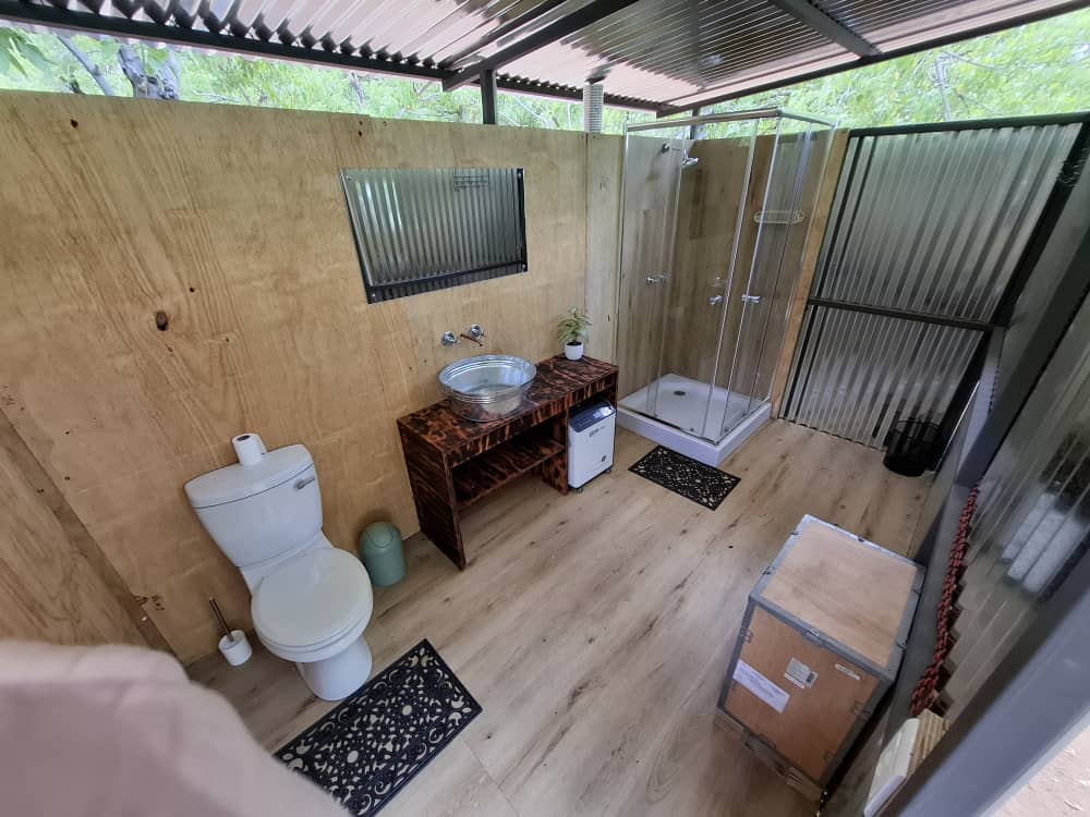 Private campsite ablution facilities at Nyime Safari Lodge