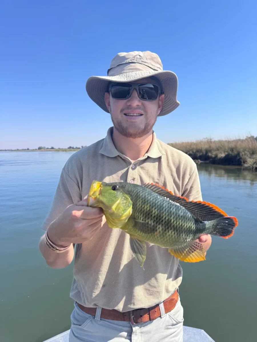 Guest with a fresh catch beside the river