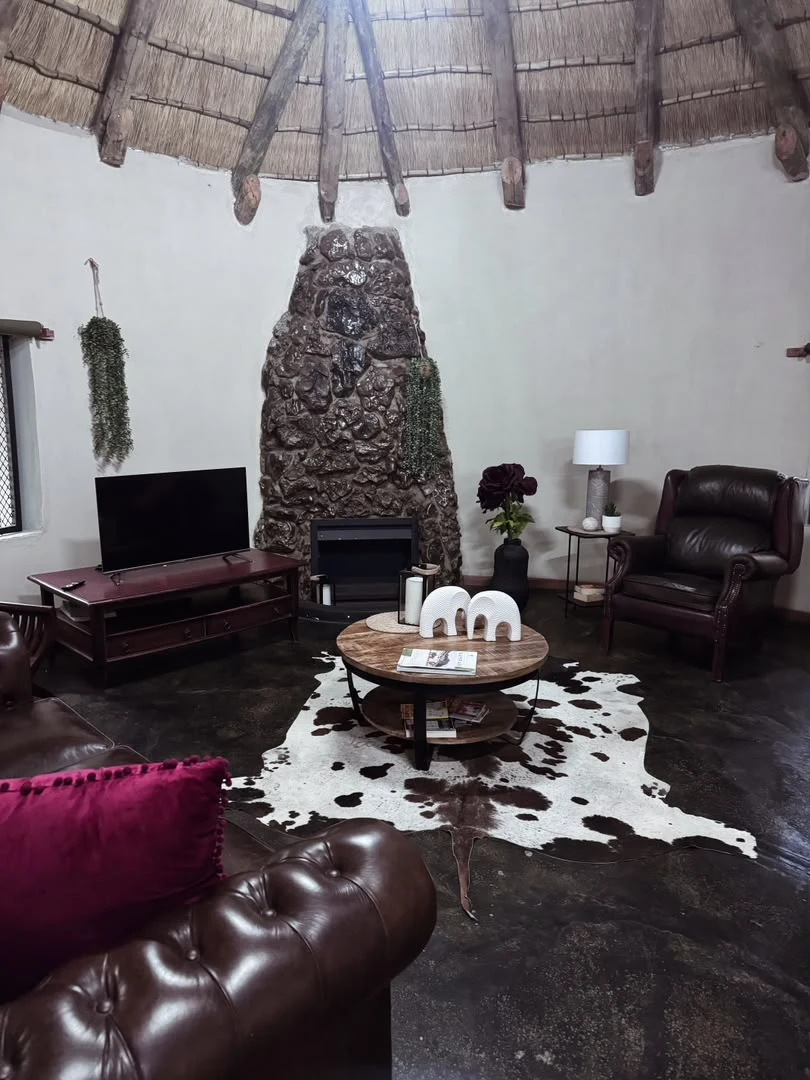Indoor fireplace area at Nyime Safari Lodge