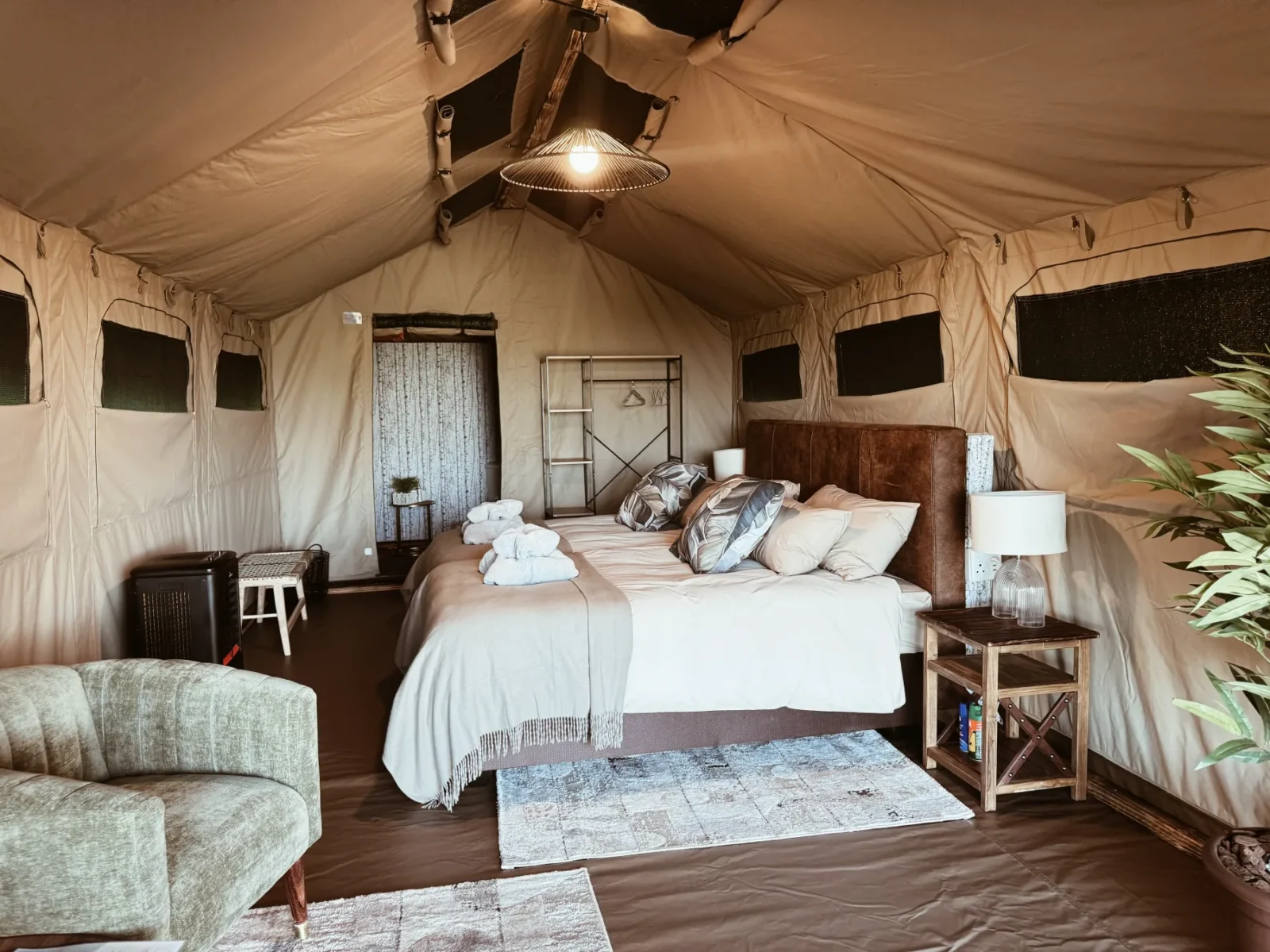 Warm, welcoming interior of a Nyime luxury safari tent