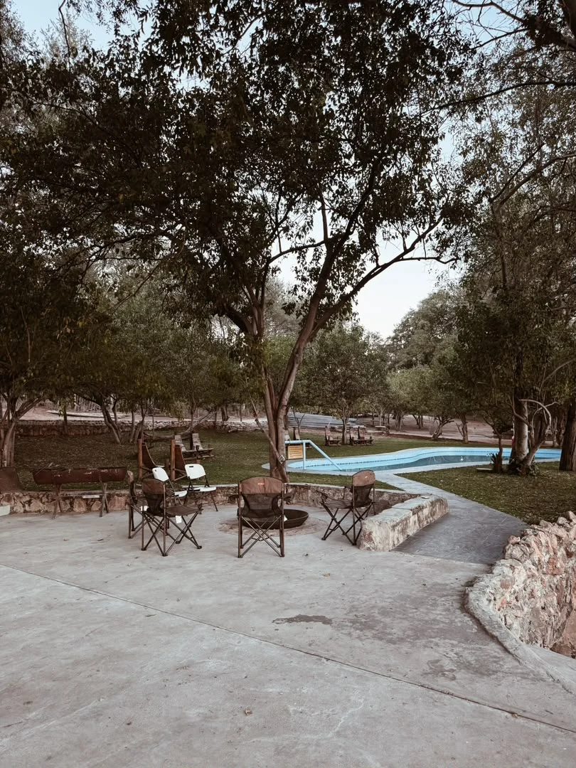 Swimming pool, firepit and outdoor seating at the lodge